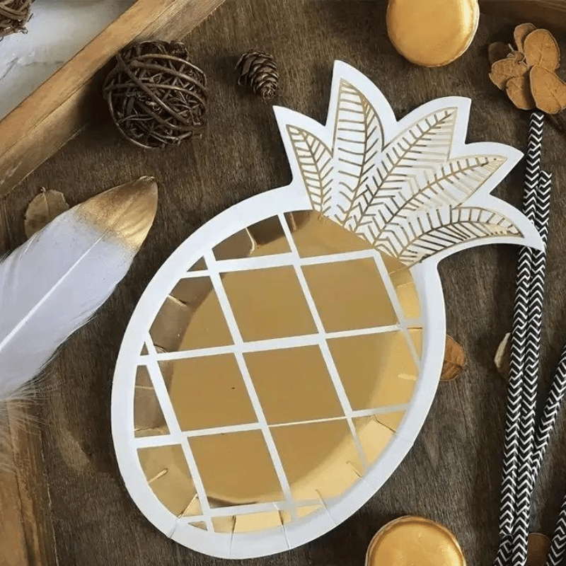 Tropical-themed shiny fold foil plates. Unique pineapple-shaped party supplies