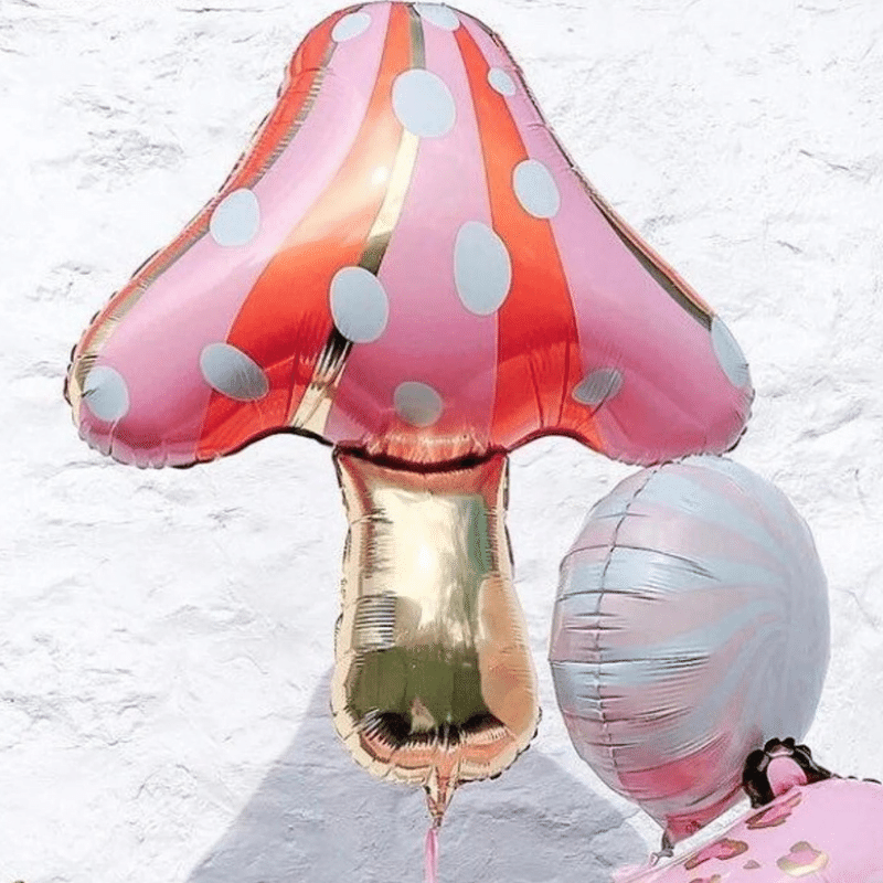Enchanting pink & orange balloon decoration. Whimsical mushroom balloon for celebrations